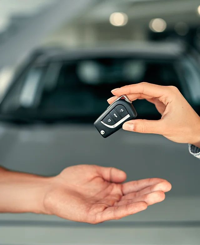 Auto locksmith working on a car key