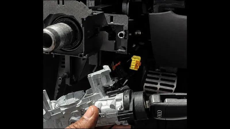 Auto locksmith repairing a car ignition