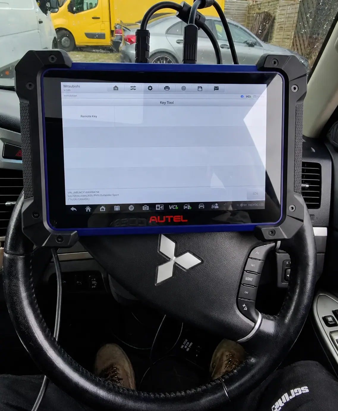 Technician running vehicle diagnostics